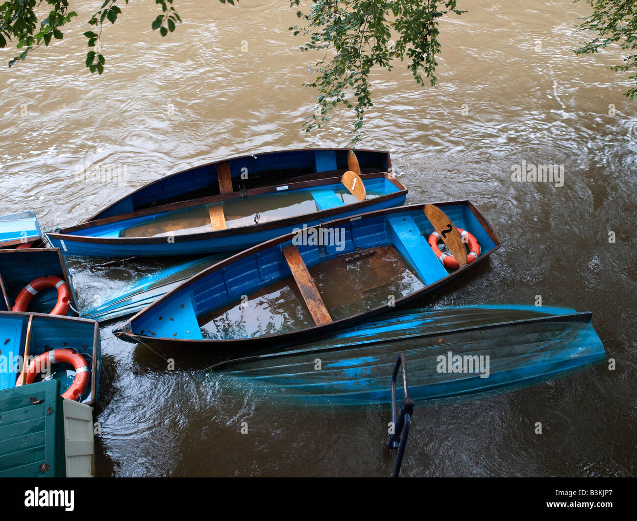 Sinking rowing boats Stock Photo