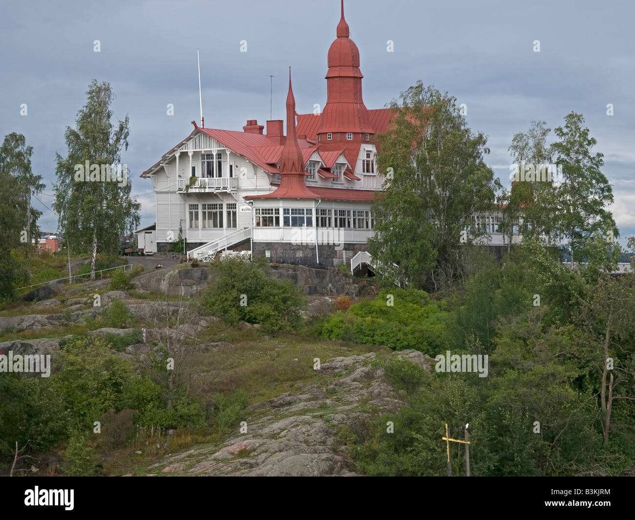 old timber wooden villa mansion on rocks on the island Klippan in the Baltic Sea in Helsinki Finland Stock Photo
