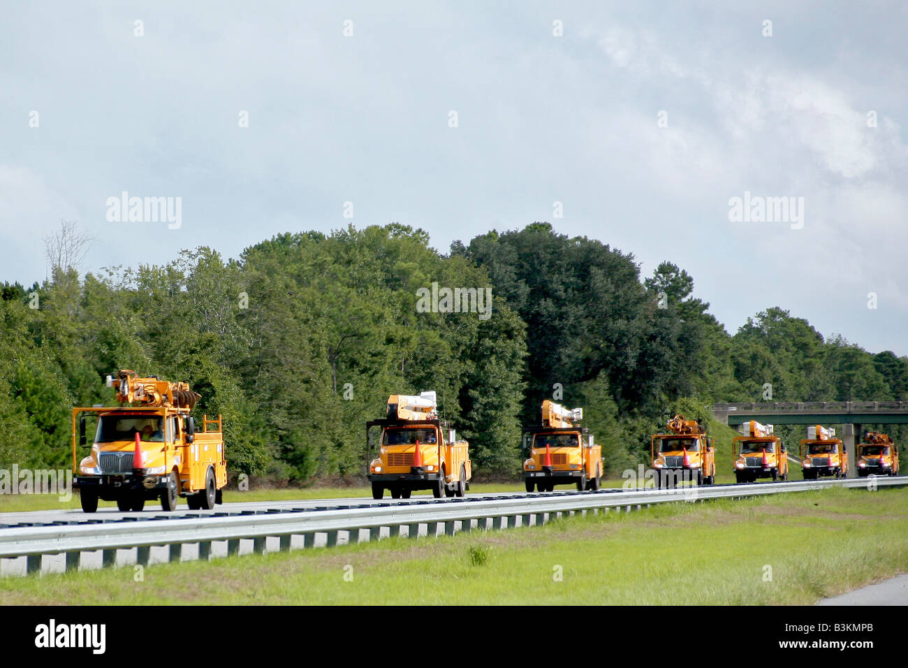Power company trucks moving south for hurricane damage Stock Photo