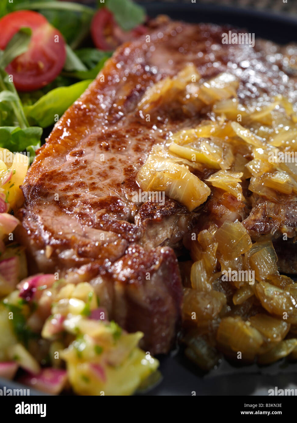 T bone steak and potato salad editorial food Stock Photo - Alamy