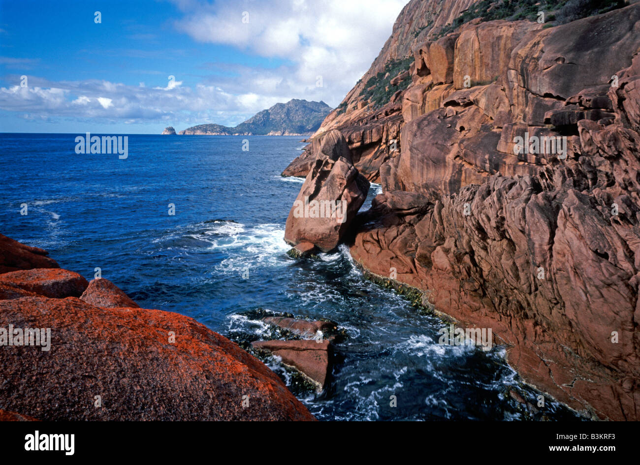 Red rocks on the East Coast of Tasmania, Australia Stock Photo - Alamy