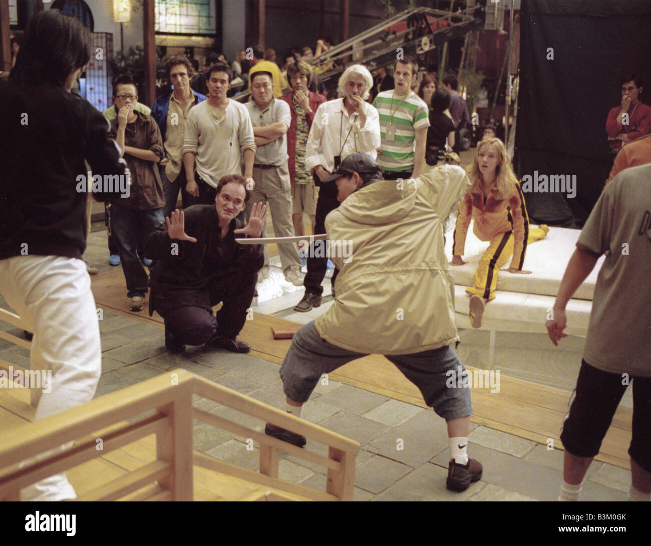 KILL BILL VOL 1   2003 Buena Vista film with Director Quentin Tarantino checking an angle prior to shooting Stock Photo