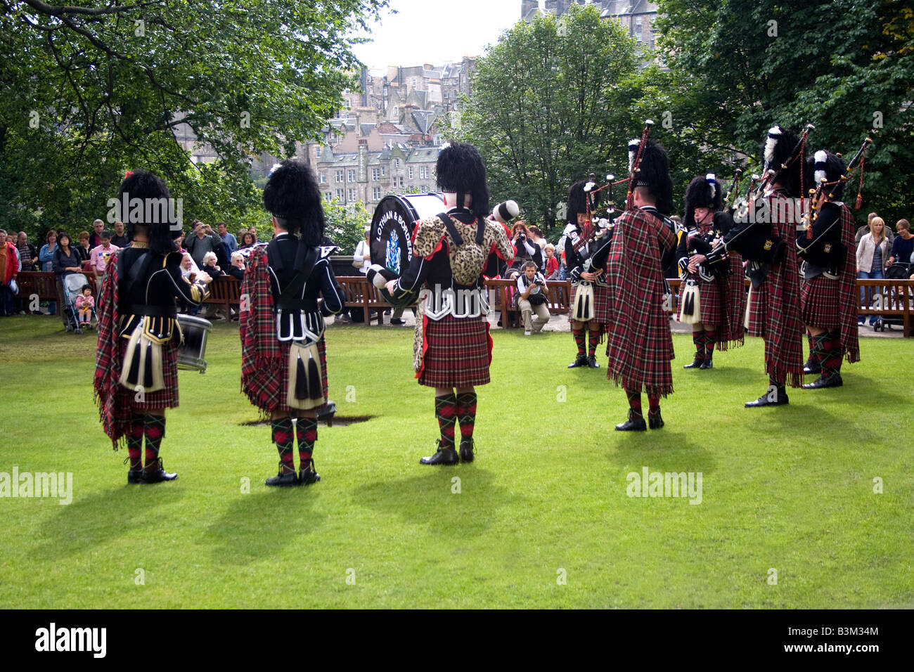 The Lothian and Borders Police Pipe Band traditional performance in Princes Street gardens during the Edinburgh Fringe Festival. Stock Photo