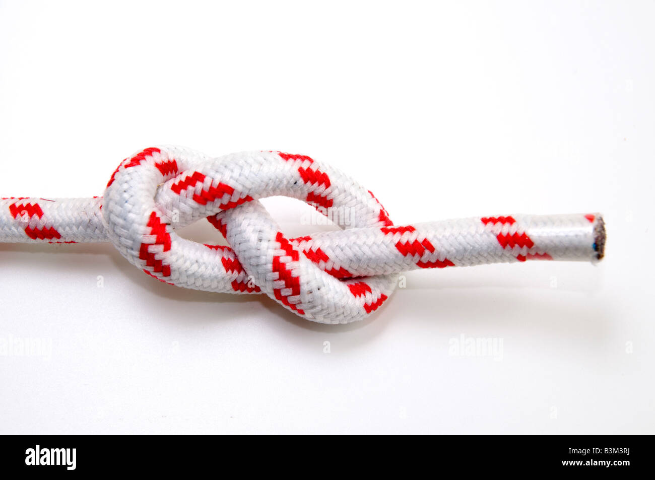 The Figure Eight Knot on white background used as a stopper at the end of a rope Stock Photo