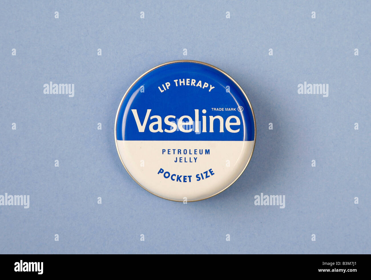 Studio shot of a pocket-sized tin of Vaseline, petroleum jelly Stock Photo