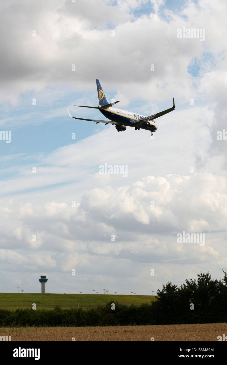 RyanAir Boeing 737-8AS Aircraft approaching Stansted Airport with ATC in background Stock Photo