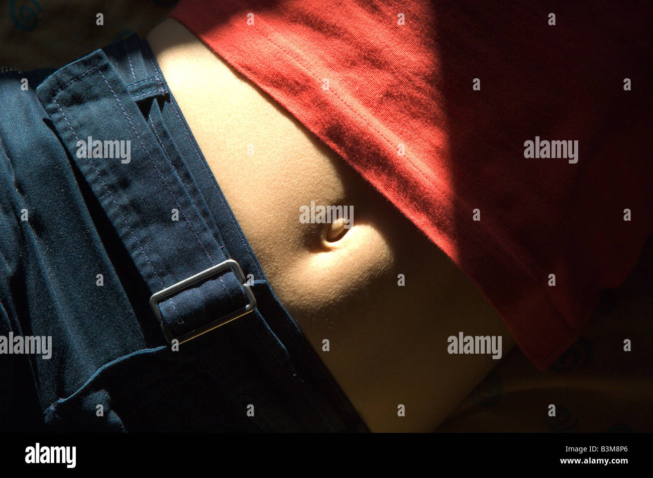 Young womans belly button Stock Photo