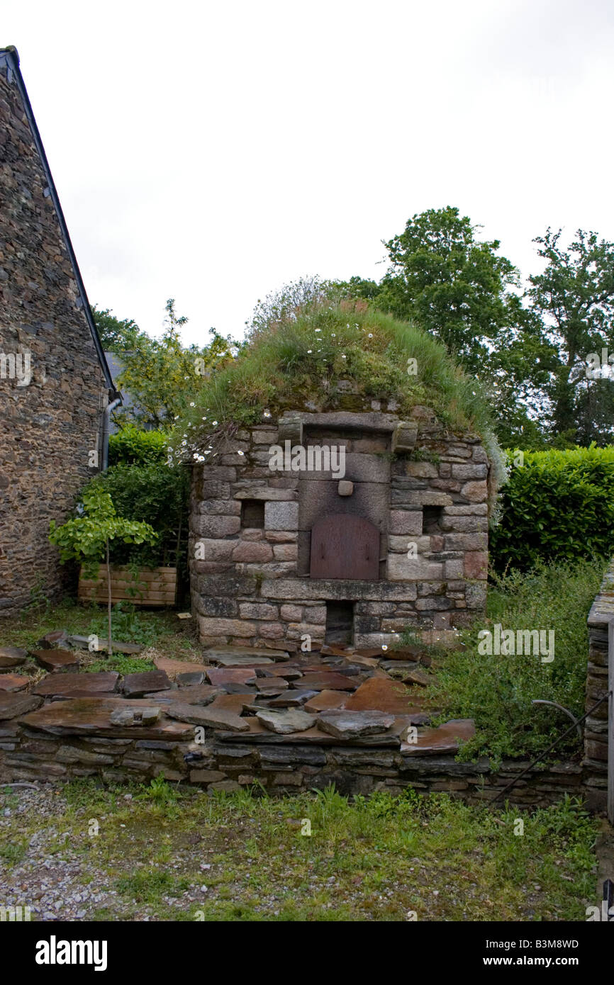 Ancient bread oven in private garden near Pontivy, Brittany, France Stock Photo