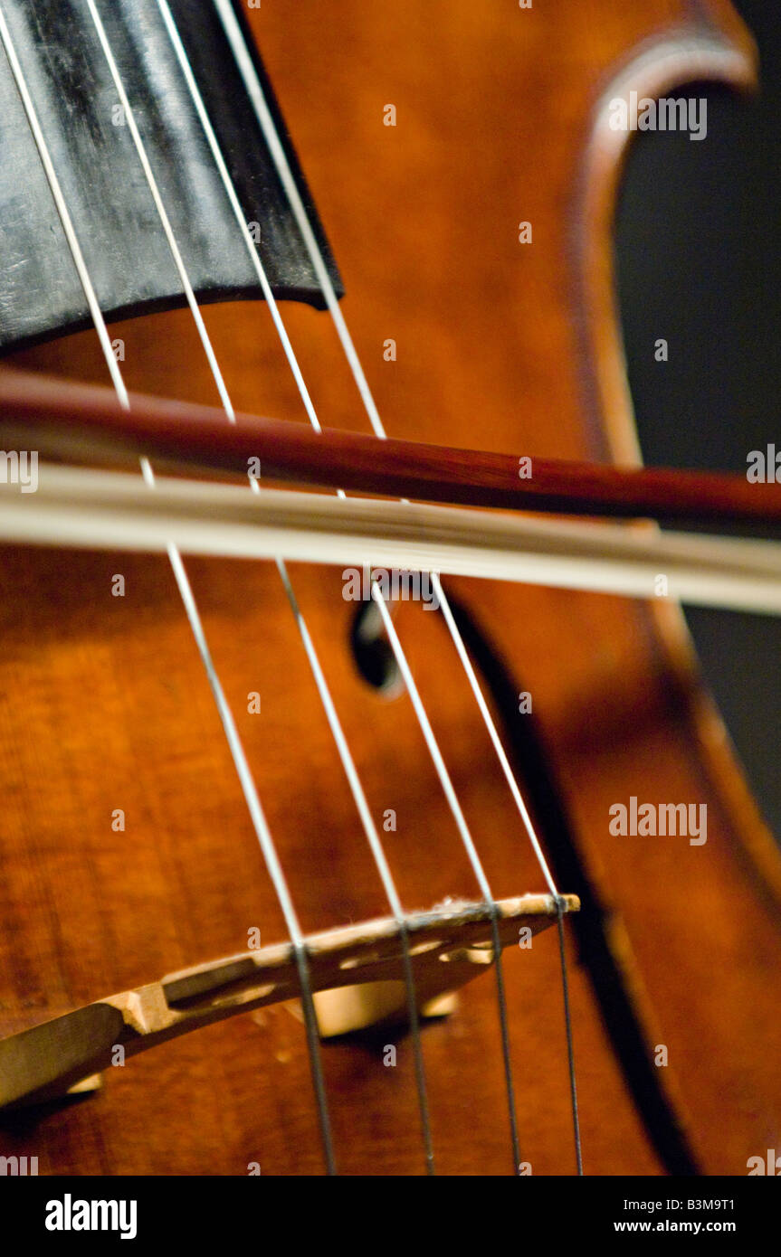 A bow on a cello strings Stock Photo Alamy