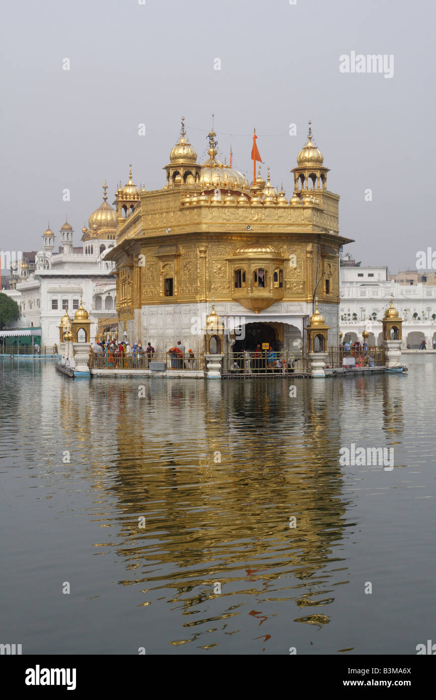 Sikh pilgrims emerging from the Golden Temple Amritsar, Darbar Sahib Stock Photo