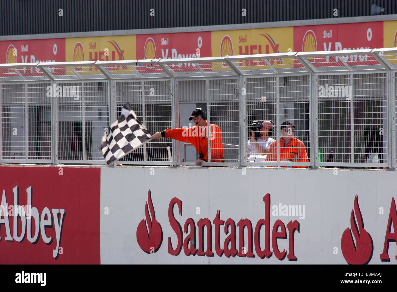 Marshalls at the finish of a raca at Silverstone holding the black abd white chequred flag Stock Photo