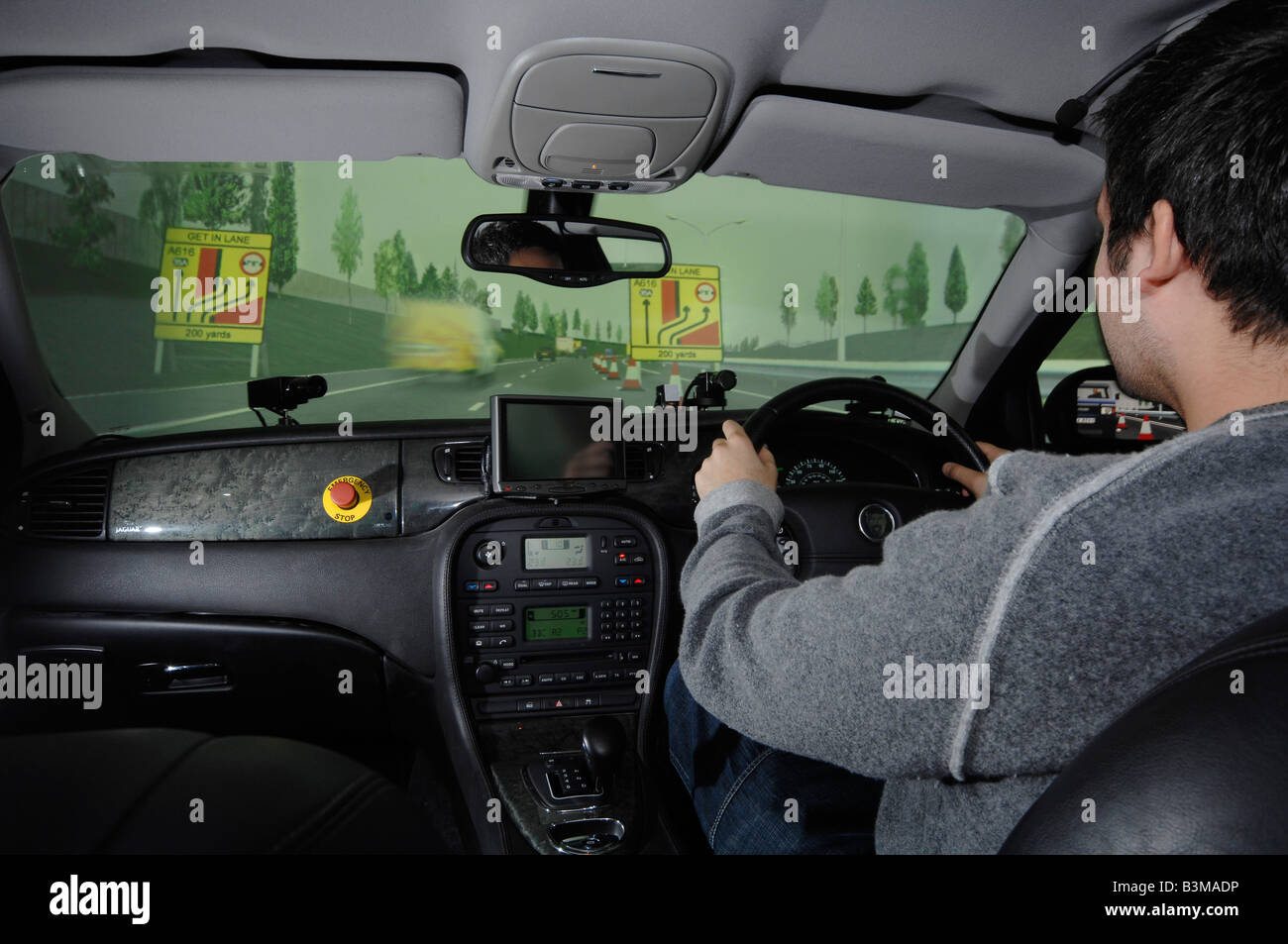 Man in a driving simulator Stock Photo - Alamy