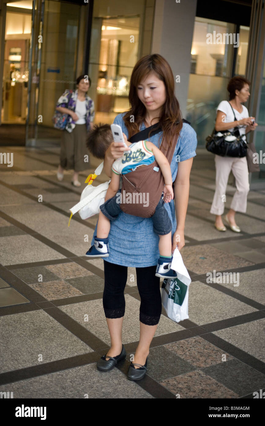 Woman carrying baby japan hi res stock photography and images Alamy