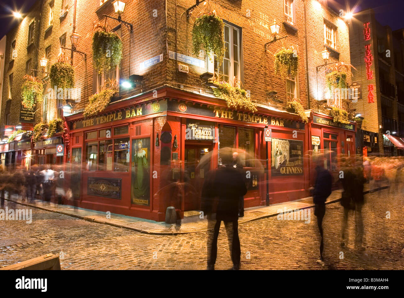 People outside the famous Temple Bar in Temple Bar, Dublin, Ireland at