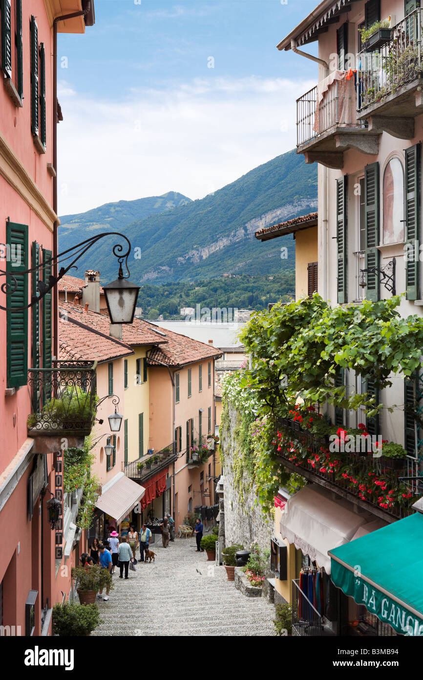 Narrow street in the town centre looking downhill towards the lake, Bellagio, Lake Como, Lombardy, Italy Stock Photo
