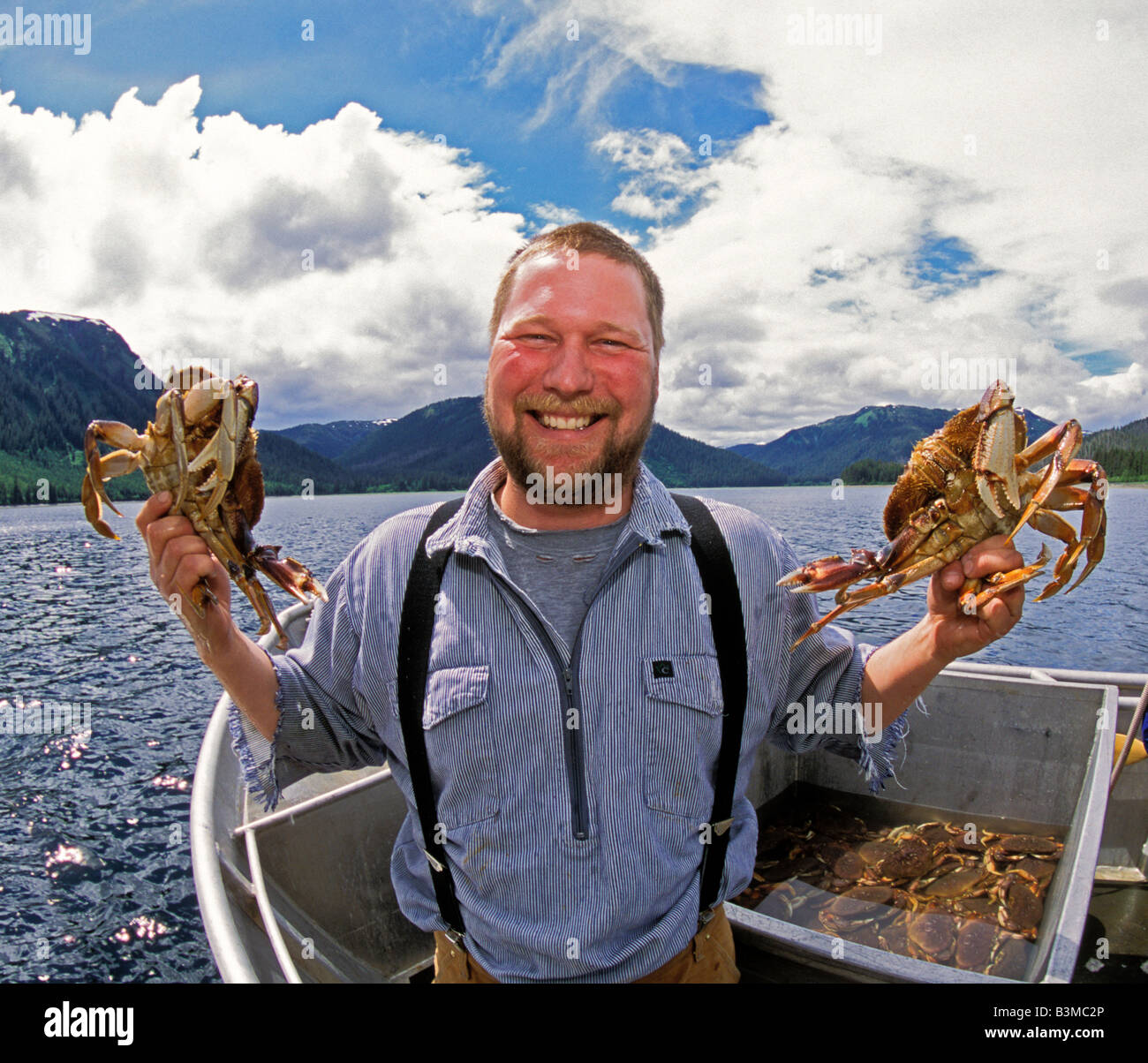 A fisherman holds up a sport caught King Crab in Berners Bay in