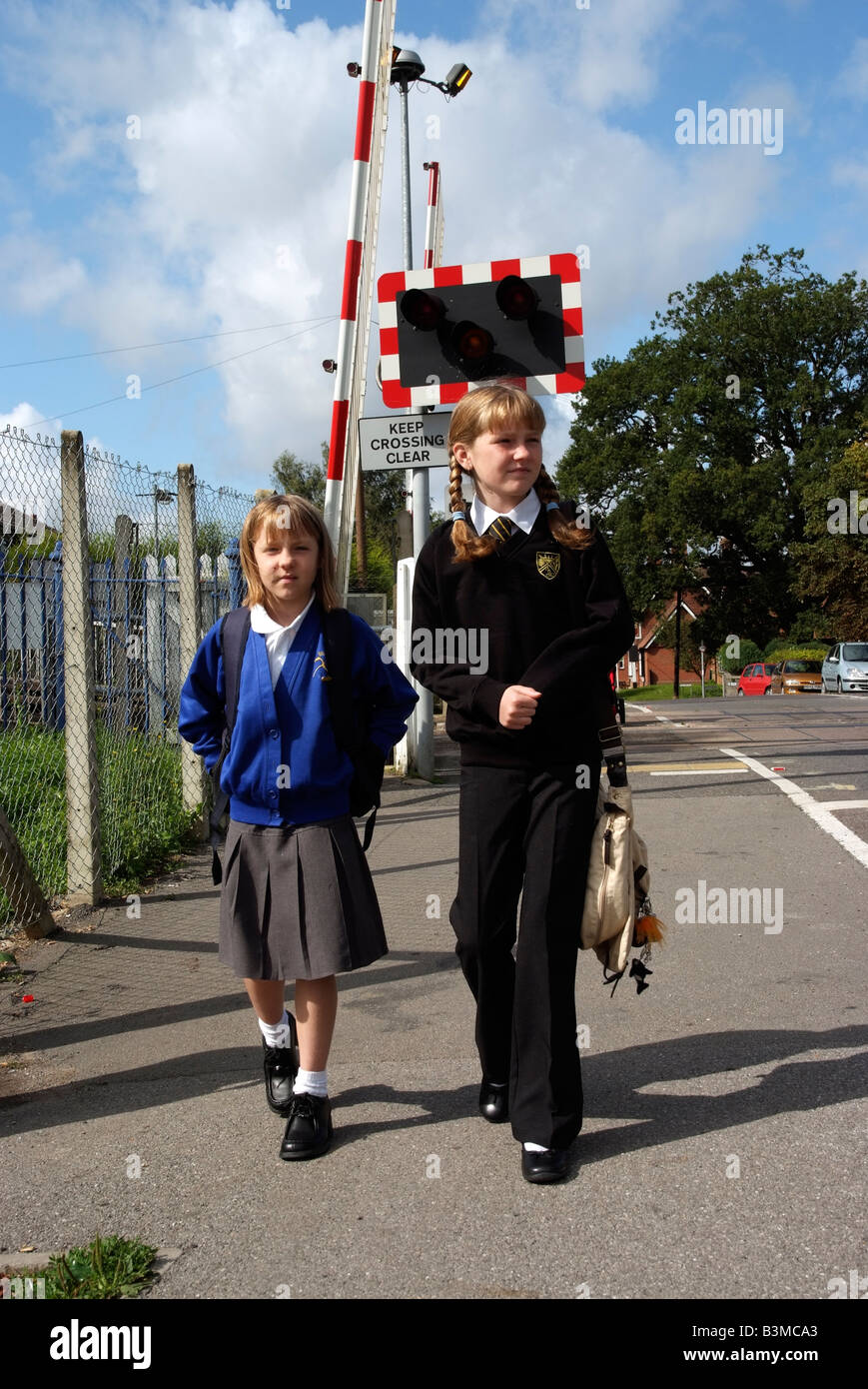 Schoolgirls in uniform walking to school Stock Photo - Alamy
