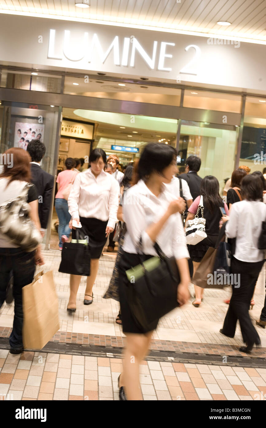 Shinjuku Tokyo Japan street scene mal Lumine shopping center people walking Stock Photo
