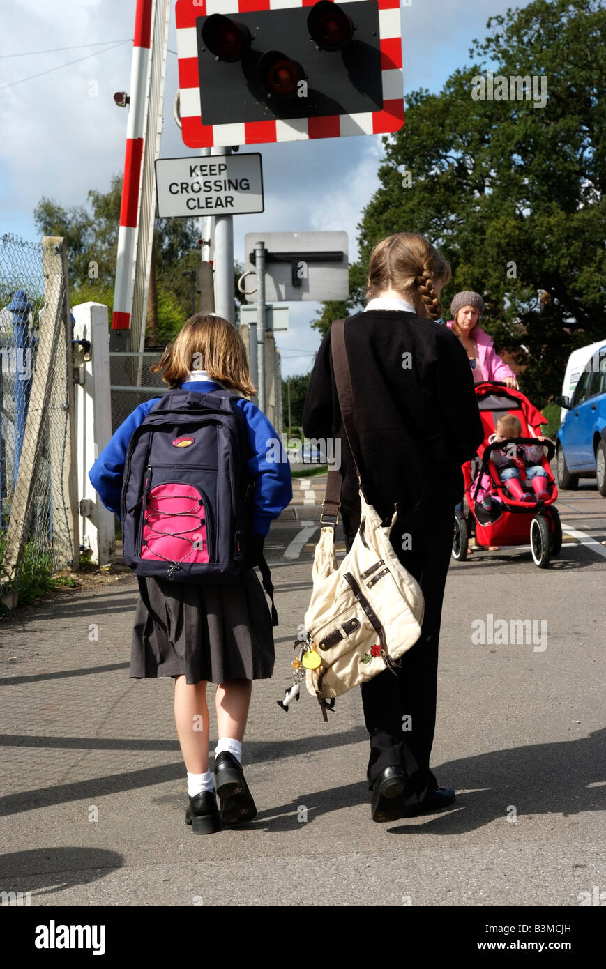 Schoolgirls in uniform walking to school Stock Photo - Alamy