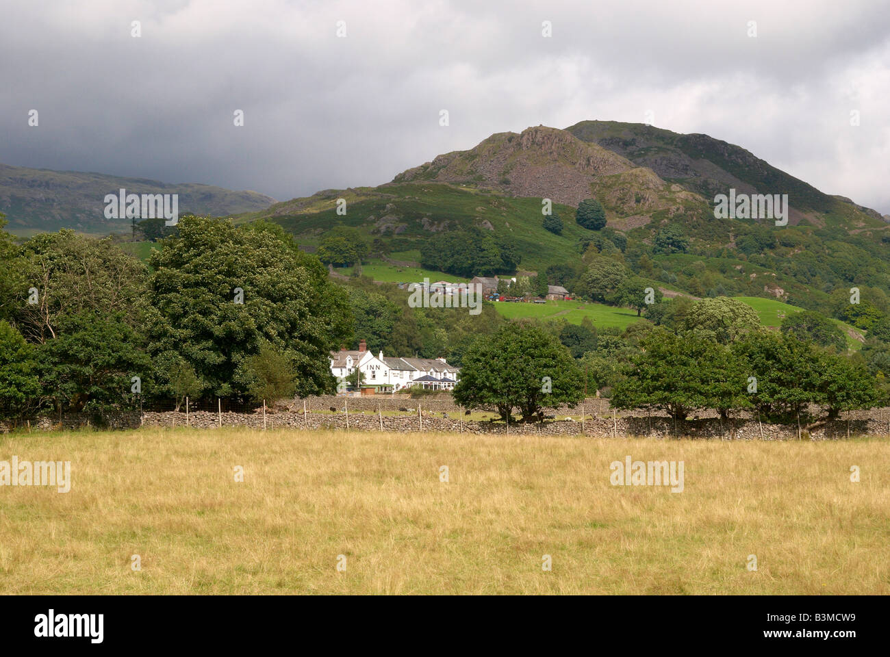 Lakeland hills above village of Boot at head of Eskdale, English Lake District seen from Ravenglass & Eskdale Rly Dalegarth stn Stock Photo