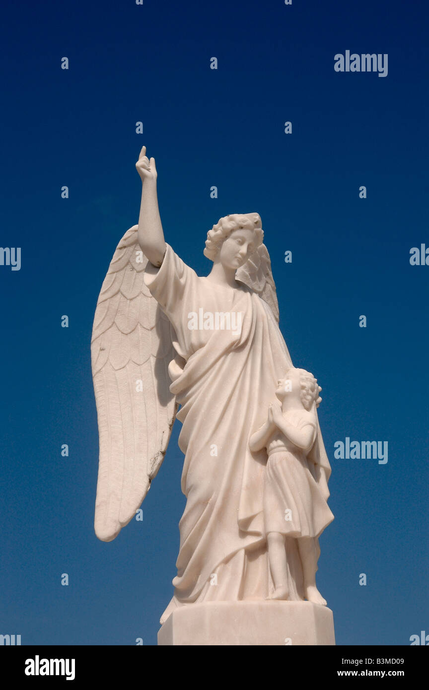 A Gravestone monument of an angel and child, in a cemetery near Figueira da Foz,Portugal. Stock Photo
