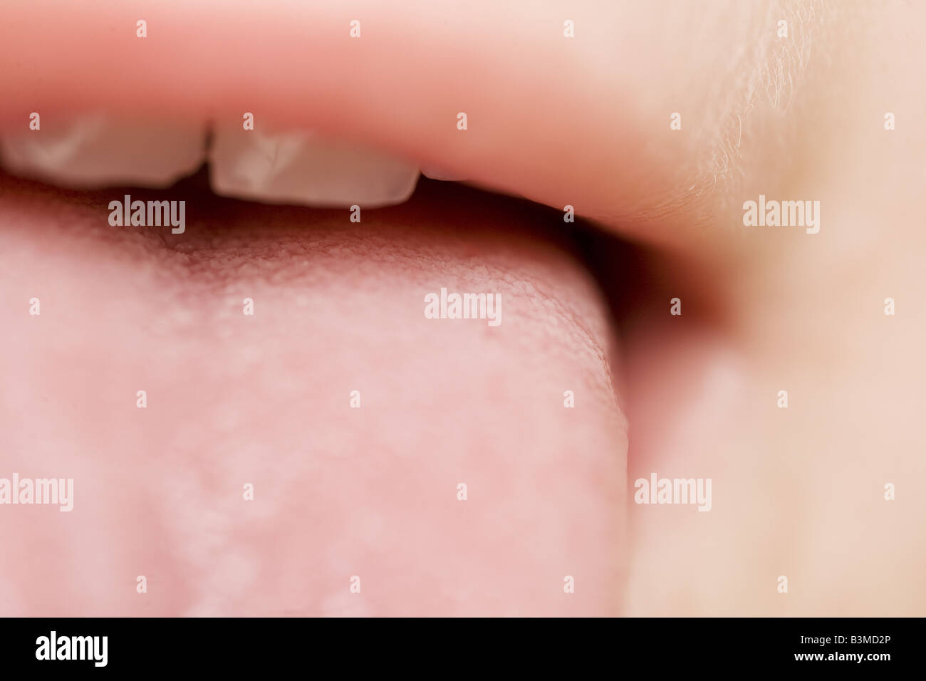 A close up of a toddler's mouth sticking out her tongue Stock Photo Alamy