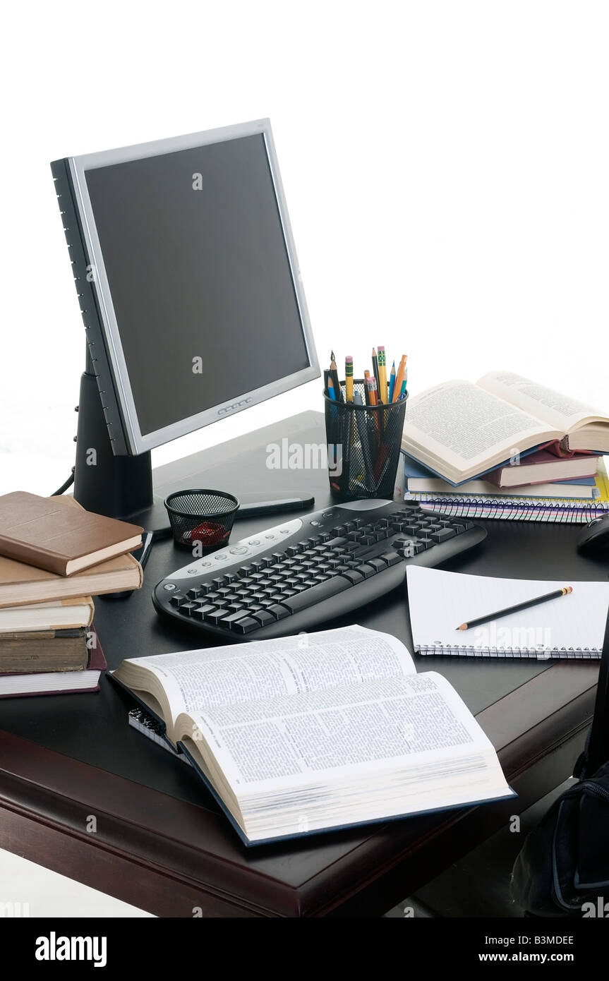 Piles of books open with a computer Working on a research paper Stock ...