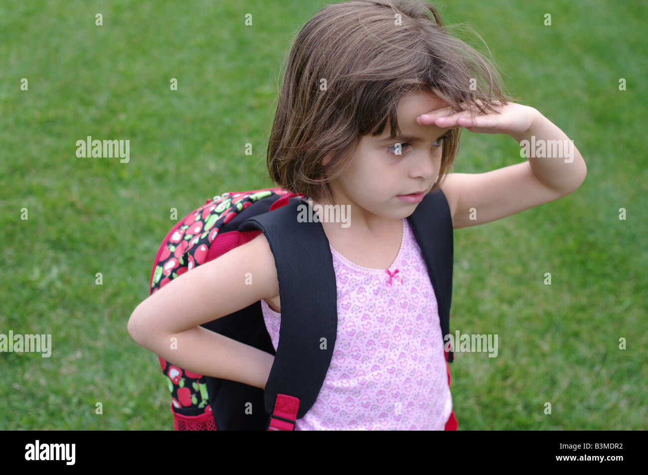 46 years old girl with backpack waiting for the start of kindergarten