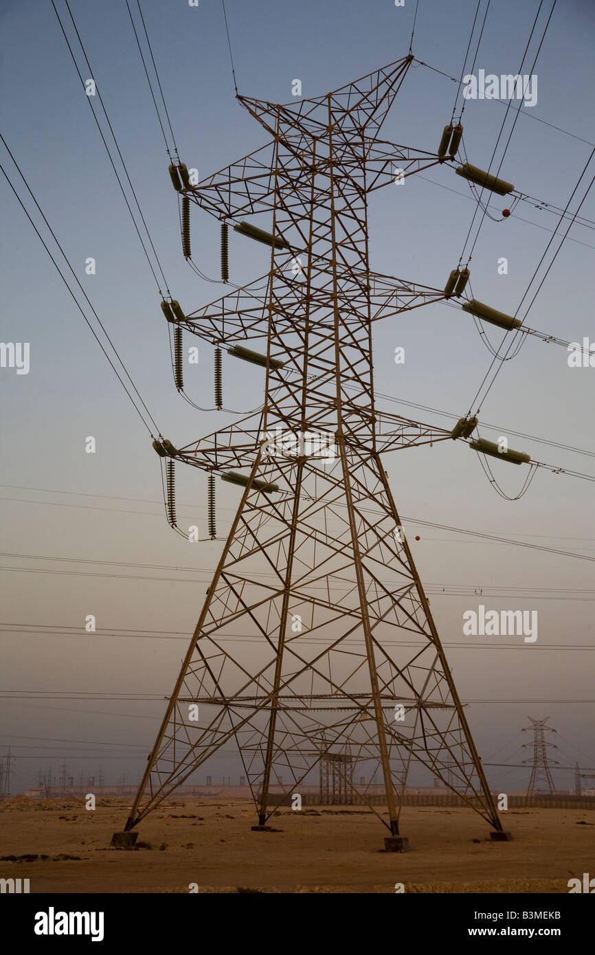 Plane and Transmission power electricity lines cables qatar Stock Photo
