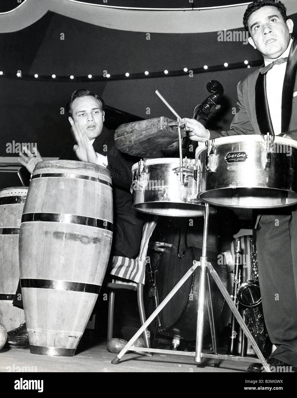 MARLON BRANDO   US film actor with Cuban bogo player Modesto Duren at Guys and Dolls  party in  1955 Stock Photo