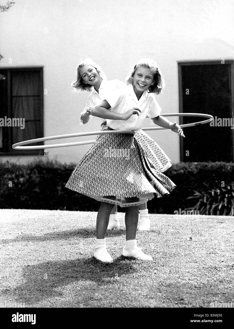 HULA-HOOP  Two American girls enjoy the craze in 1957 Stock Photo