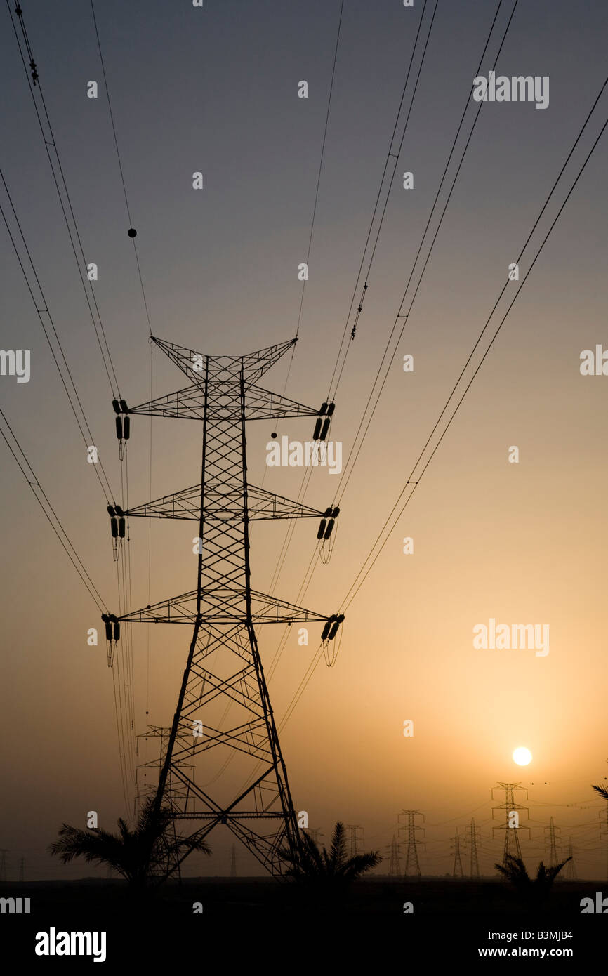 Plane and Transmission power electricity lines cables qatar Stock Photo