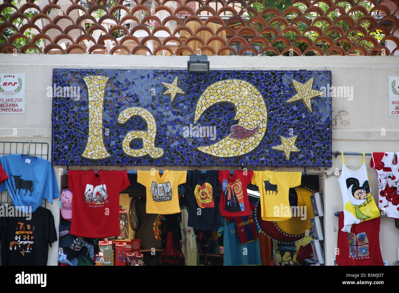 The Moon clothes shop.  Colourful street display of wares in Barcelona Stock Photo