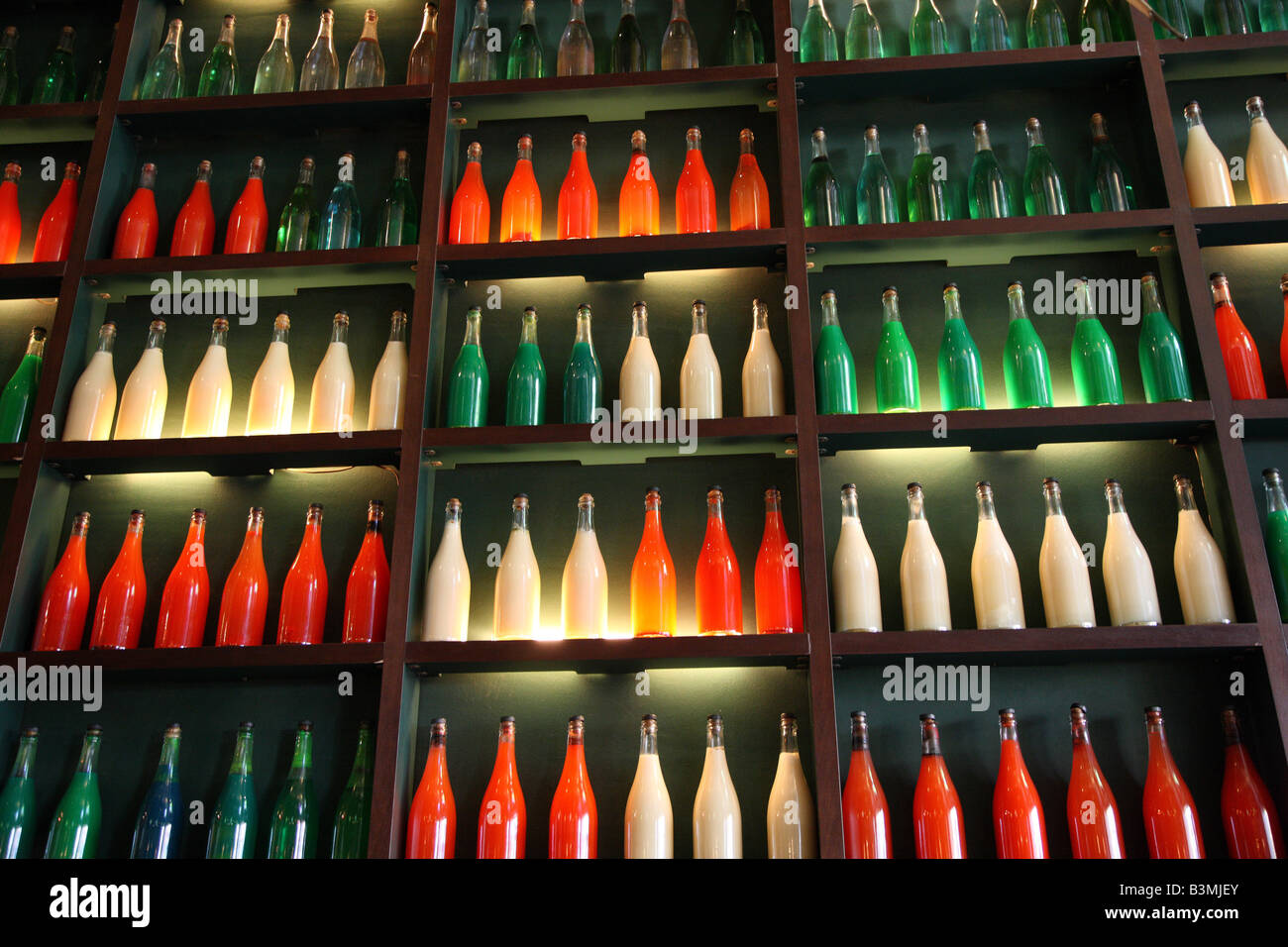 Decorative bottles on display in an Italian restaurant Stock Photo Alamy