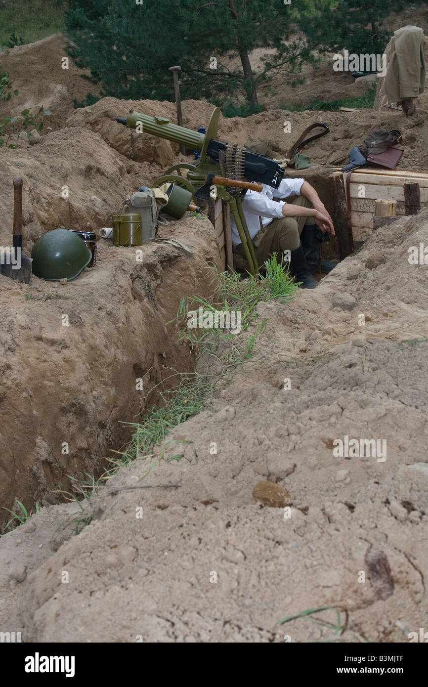 Scene from World War 2 Polish soldier in trench is waiting for orders
