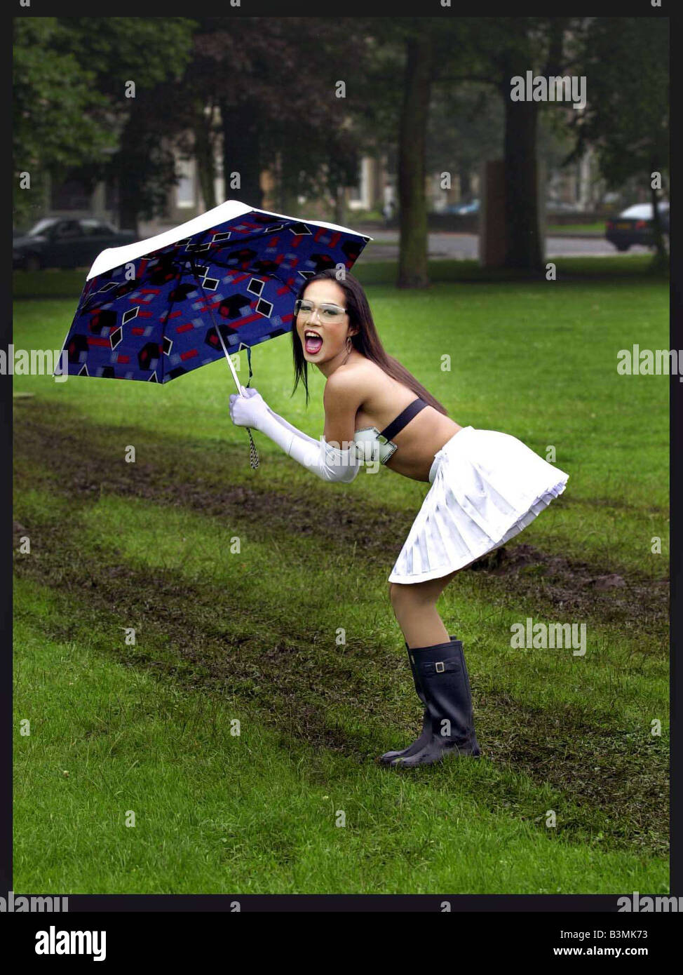 The famous Thai Ladyboys of Bangkok in Edinburgh for the Festival July 2002 The Ladyboys dancing in the rain and mud mirrorpix Stock Photo
