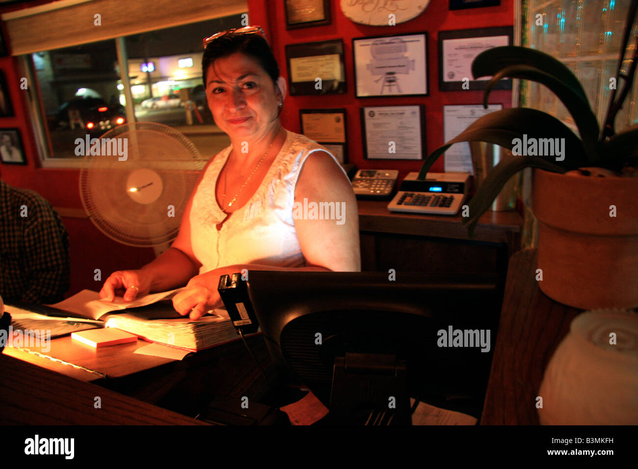 Hostess working the front desk at a restaurant Stock Photo Alamy