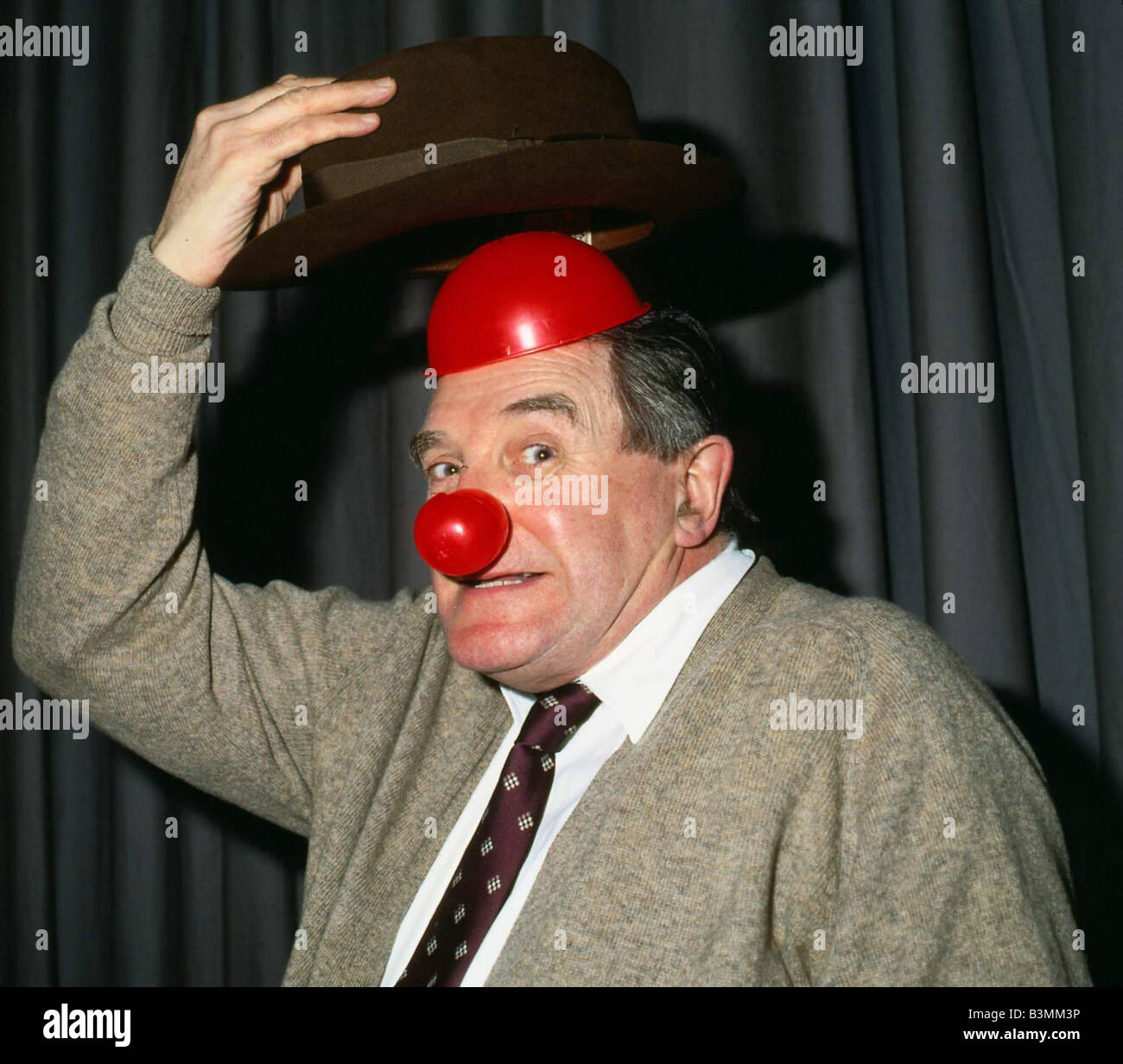 Jimmy Logan wearing red nose March 1989 Stock Photo