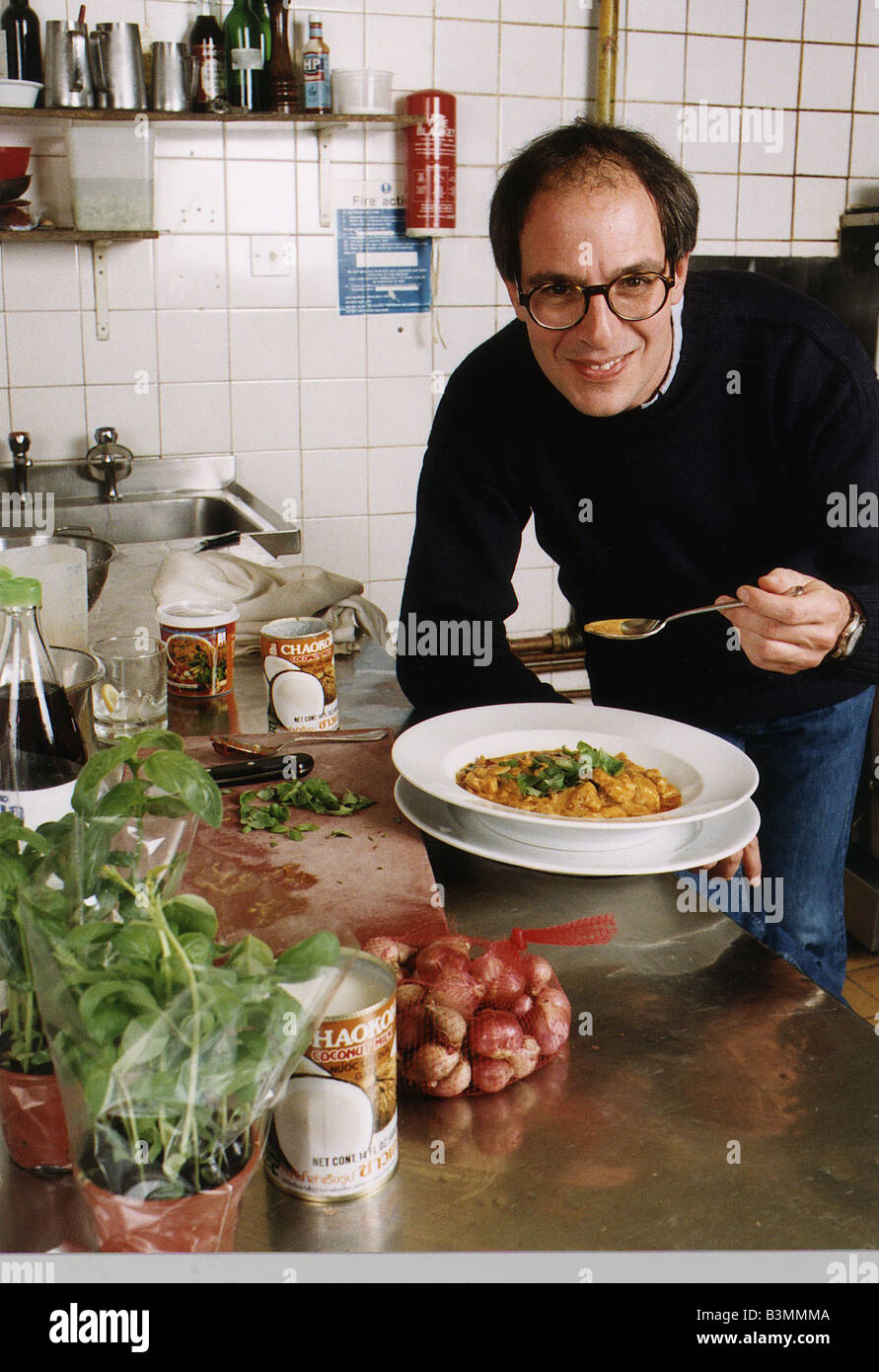 Loyd Grossman TV Presenter of Master Chef in his wn kitchen trying out ...