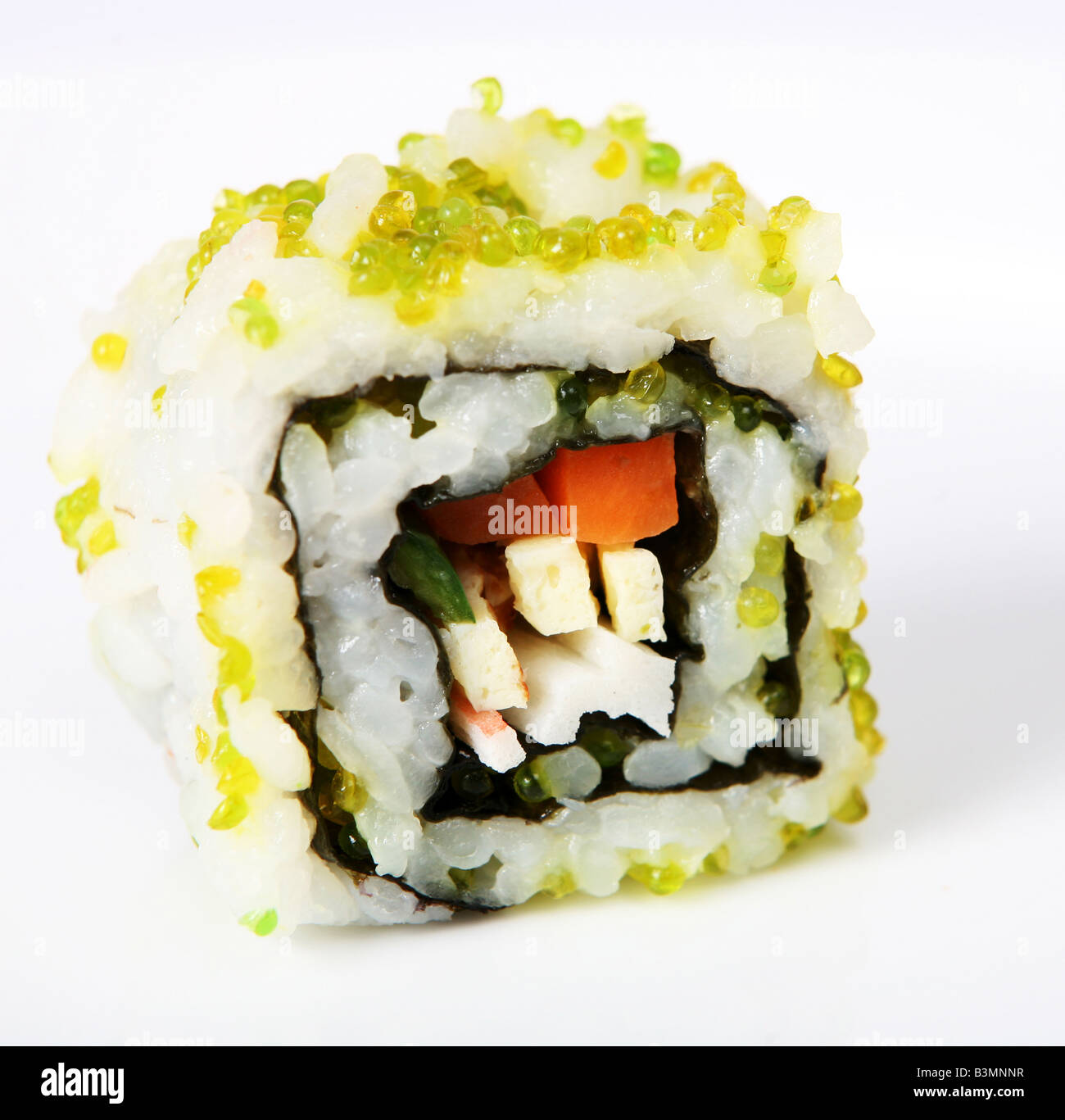 A California roll uramaki sushi close up with green coloured lumpfish caviar Stock Photo