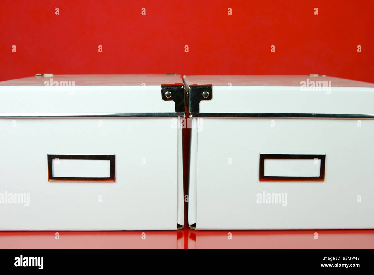 Isolate Storage Boxes Storage boxes isolated against a red background Stock Photo - Alamy