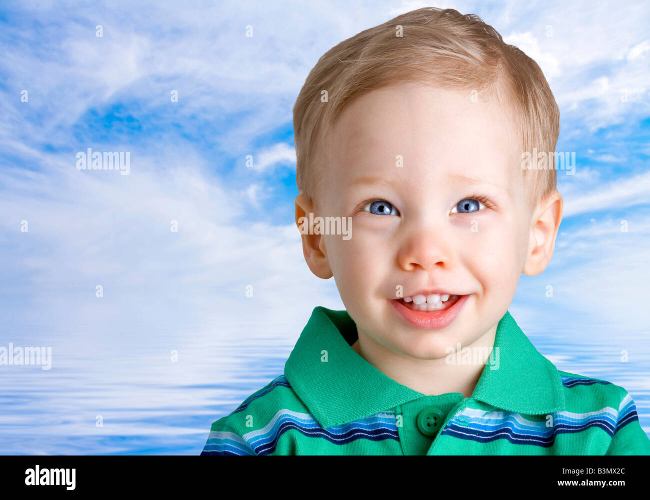 Happy boy over water and sky background Stock Photo - Alamy