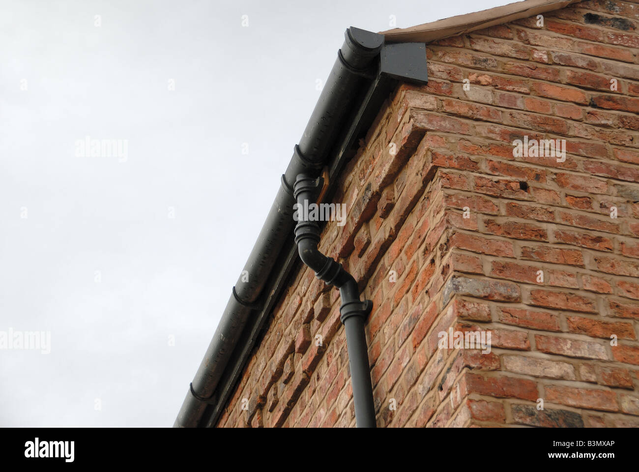 Close up of brickwork morter and gutter Stock Photo