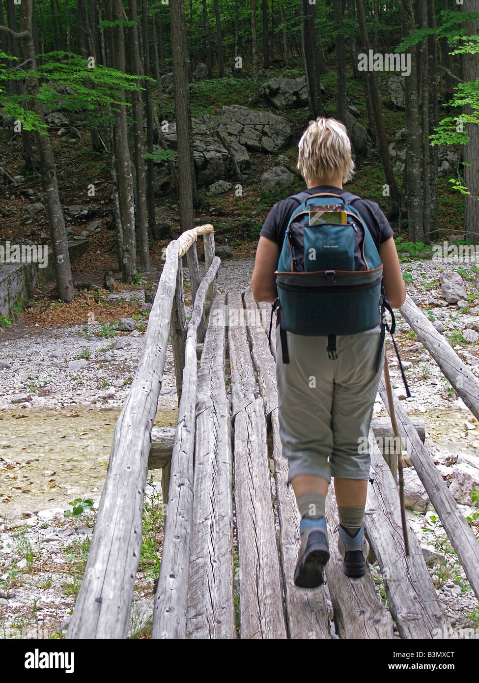 Female hiker walks on bridge hi-res stock photography and images - Alamy