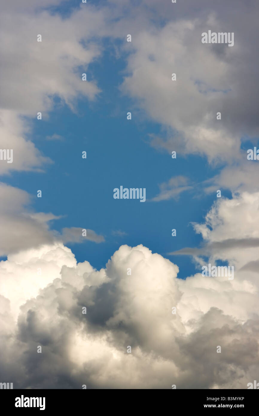 cloud in the blue sky in a gorwing dark storm Stock Photo - Alamy
