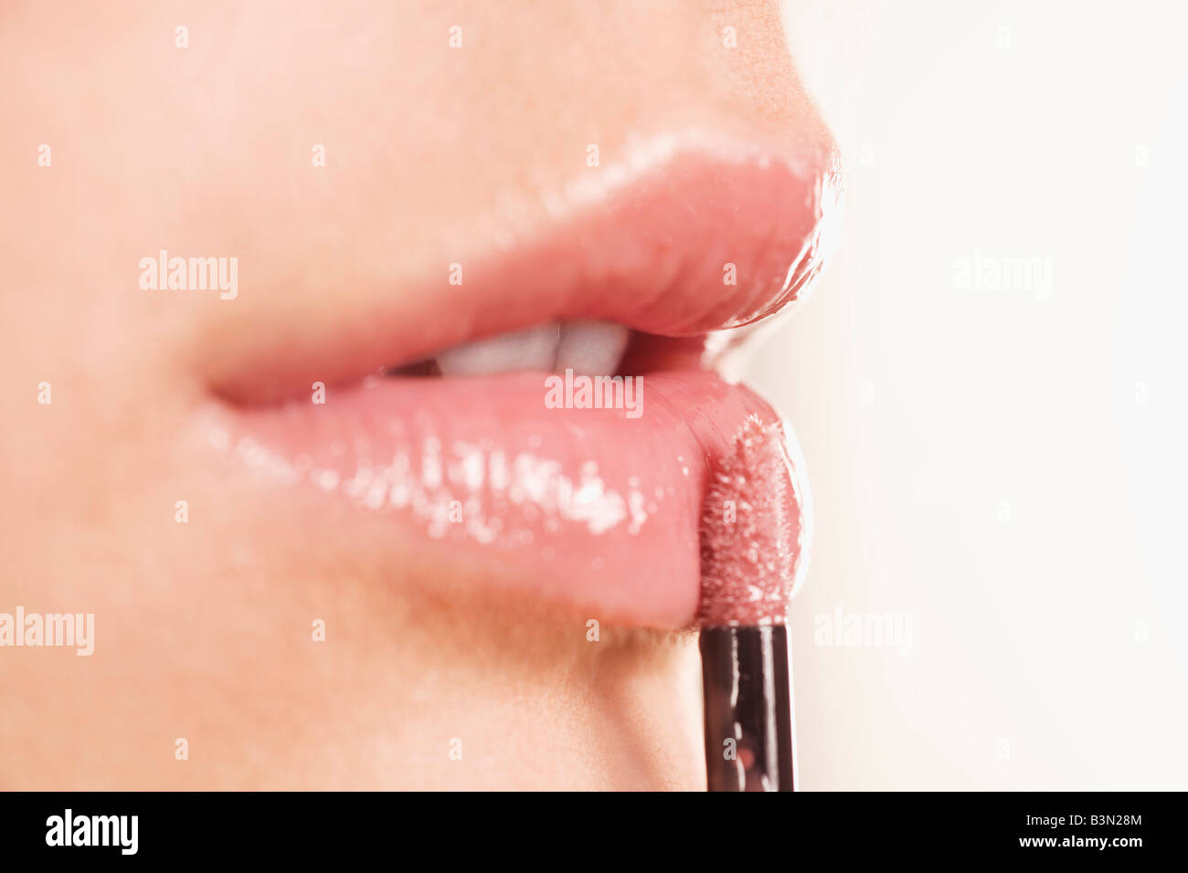 Applying lipstick, Close up Stock Photo