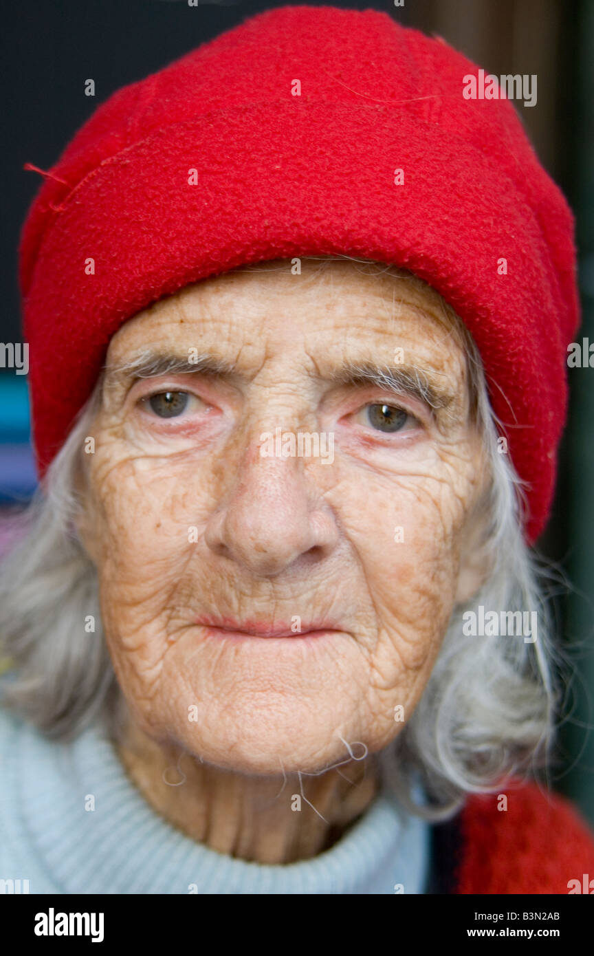Old woman with red hat Stock Photo