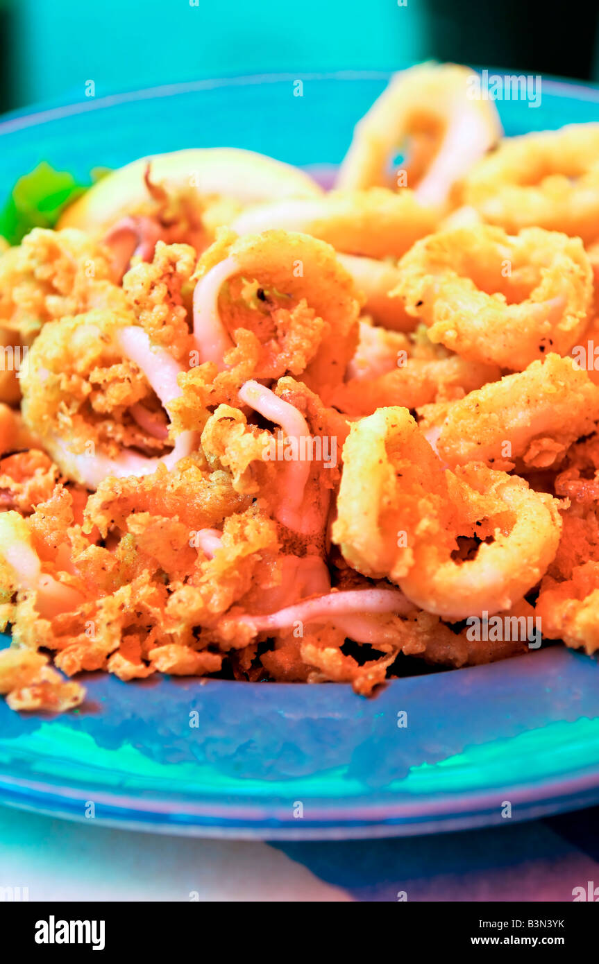 Deep fried calamari rings on a dish Stock Photo - Alamy