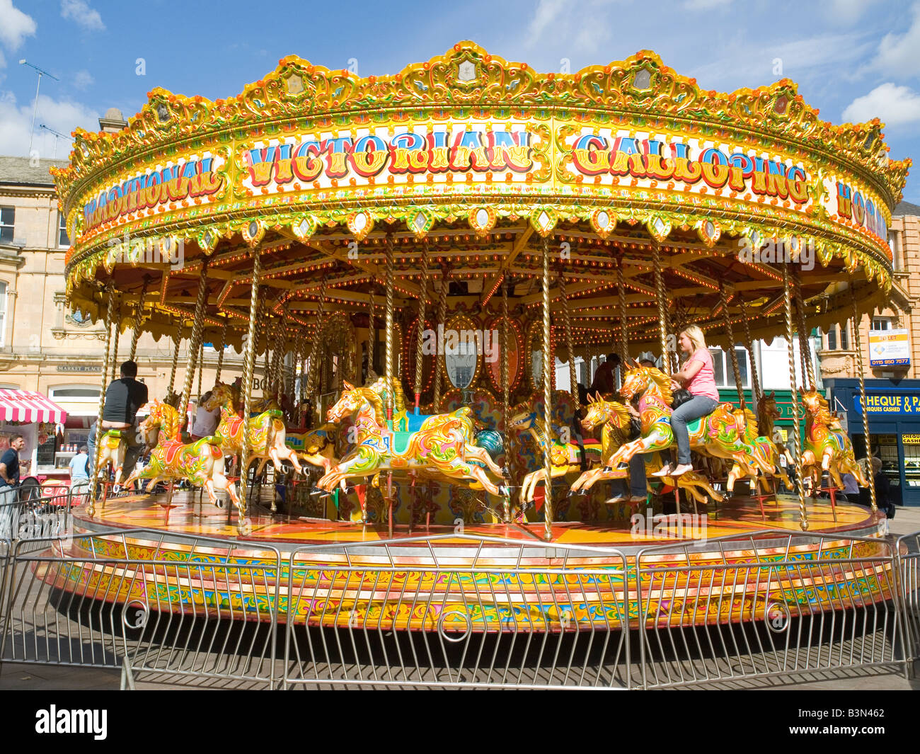 The Galloping Victorian Carousel Ride at the funfair in The Galloping Victorian Carousel Ride at the funfair in