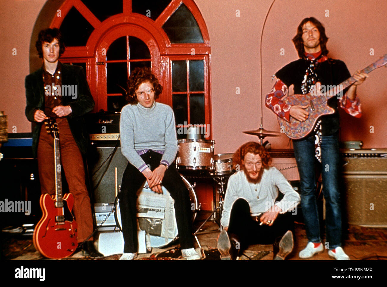 BLIND FAITH   UK rock group group in 1969 with Eric Clapton at left and Ginger Baker sitting Stock Photo